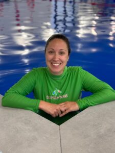 Harriet wearing a green Turtle Tots top in the Wellingborough pool